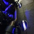 Close-up of blue LED illumination around the motorcycle passenger footboard
