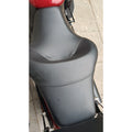 Close-up of the leatherite upholstery and stitching on the full motorcycle seat