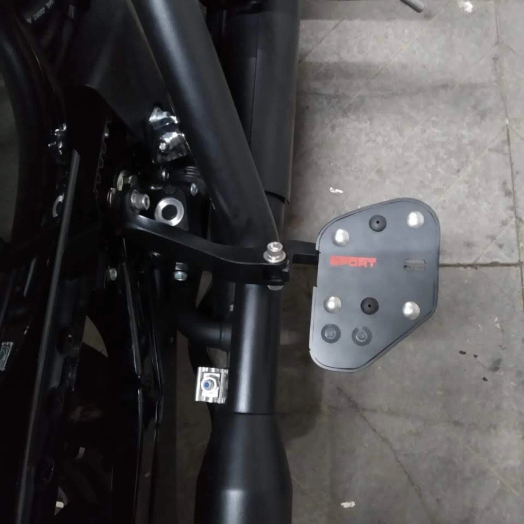 AeeDEA rider footboard mounted beside the motorcycle frame
