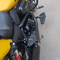 Yellow motorcycle showing the installed mid-mount rider footboards