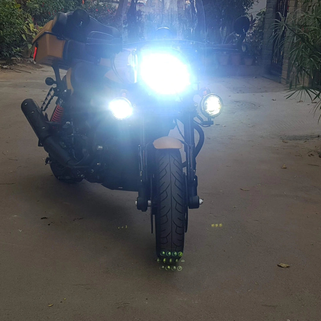 Motorcycle auxiliary light switched on, showing its bright front beam