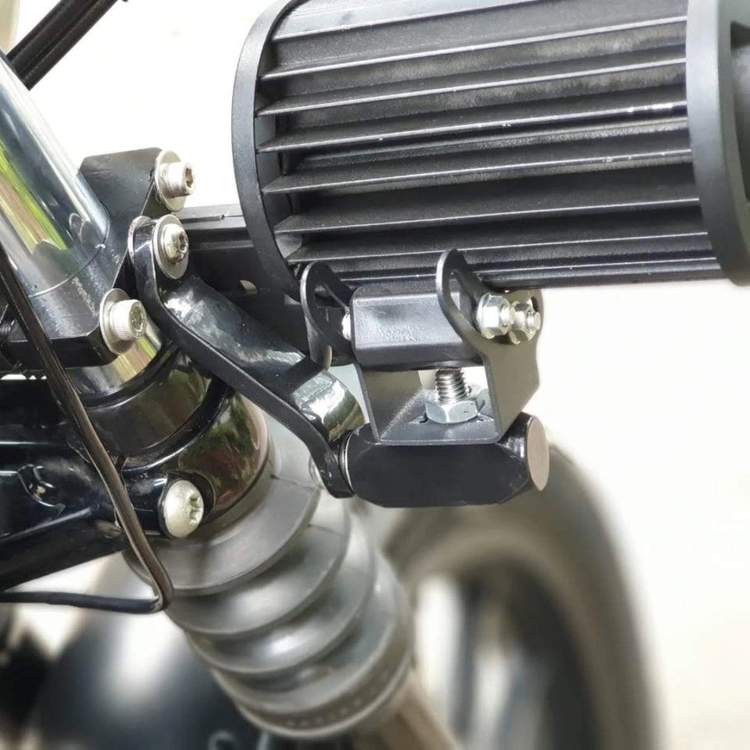 Close-up of an auxiliary light and its fork mounting arrangement