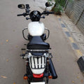 Front view of a white motorcycle showing the installed black crash guard