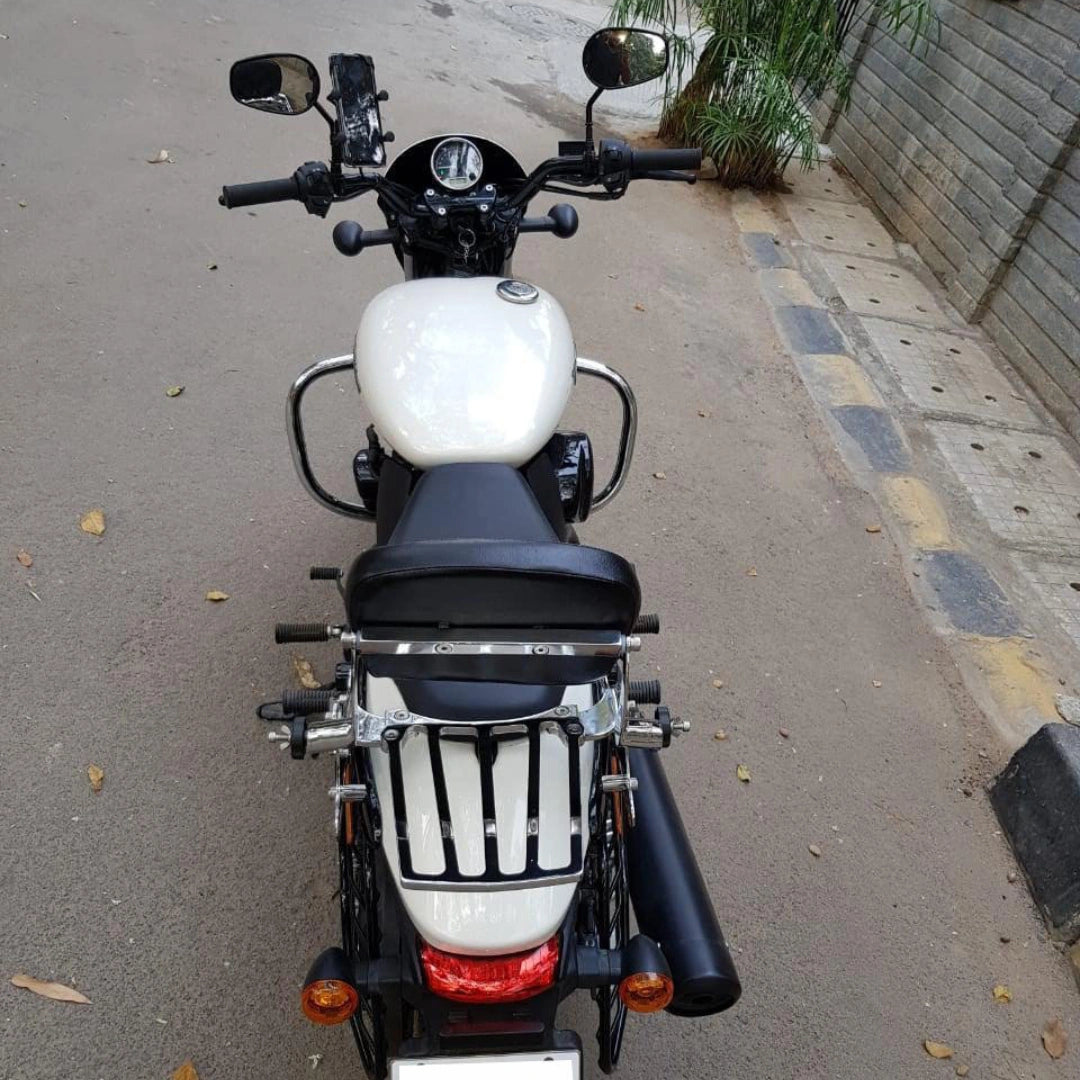 Front view of a white motorcycle showing the installed black crash guard