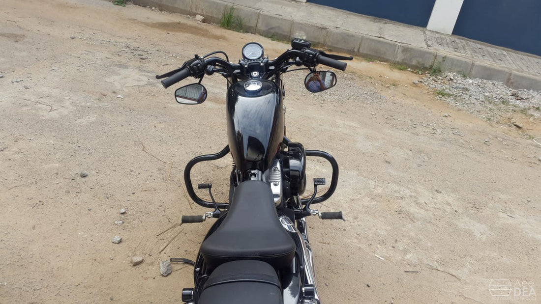 Top view of a black motorcycle fitted with tubular engine crash guards on both sides
