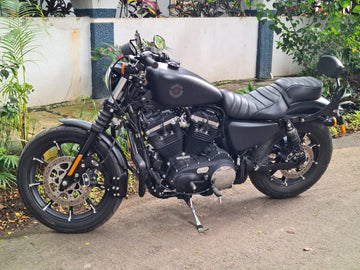 Black motorcycle with a front mudslinger mounted around the front wheel