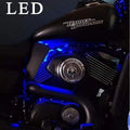 Blue LED lighting illuminating the motorcycle engine area around the heat deflector