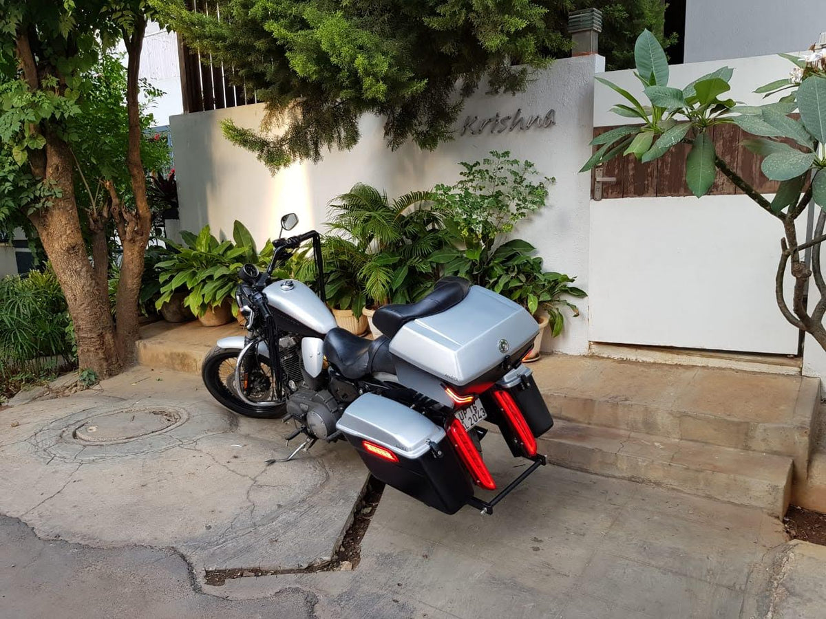 Motorcycle with engine heat deflectors installed, viewed from the side