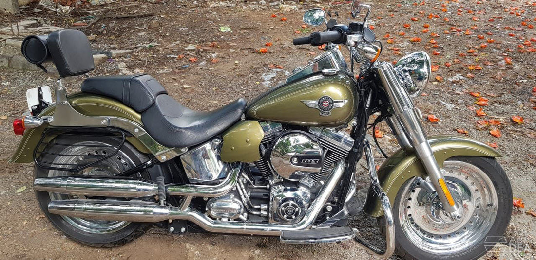 AeeDEA heat deflectors installed around the engine area of an olive-green cruiser motorcycle