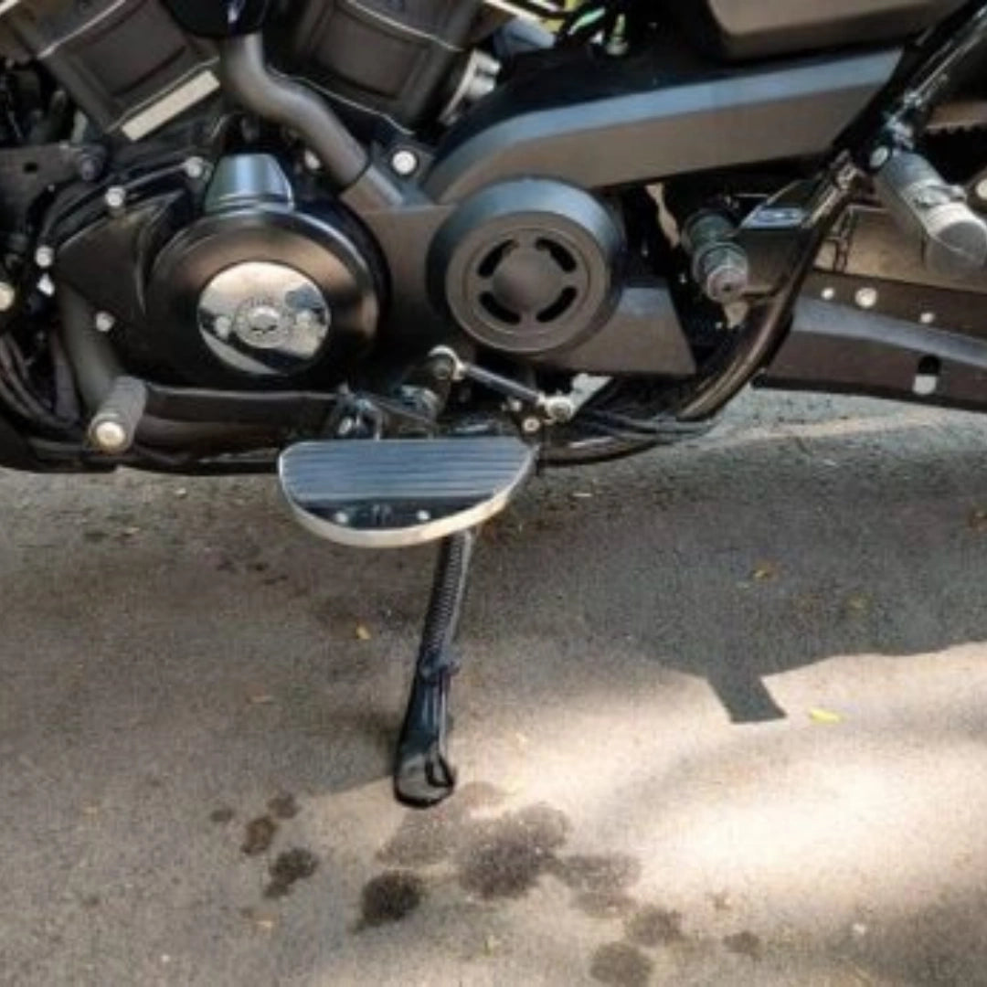 Close-up of motorcycle mid-mount footboard near the engine and foot controls