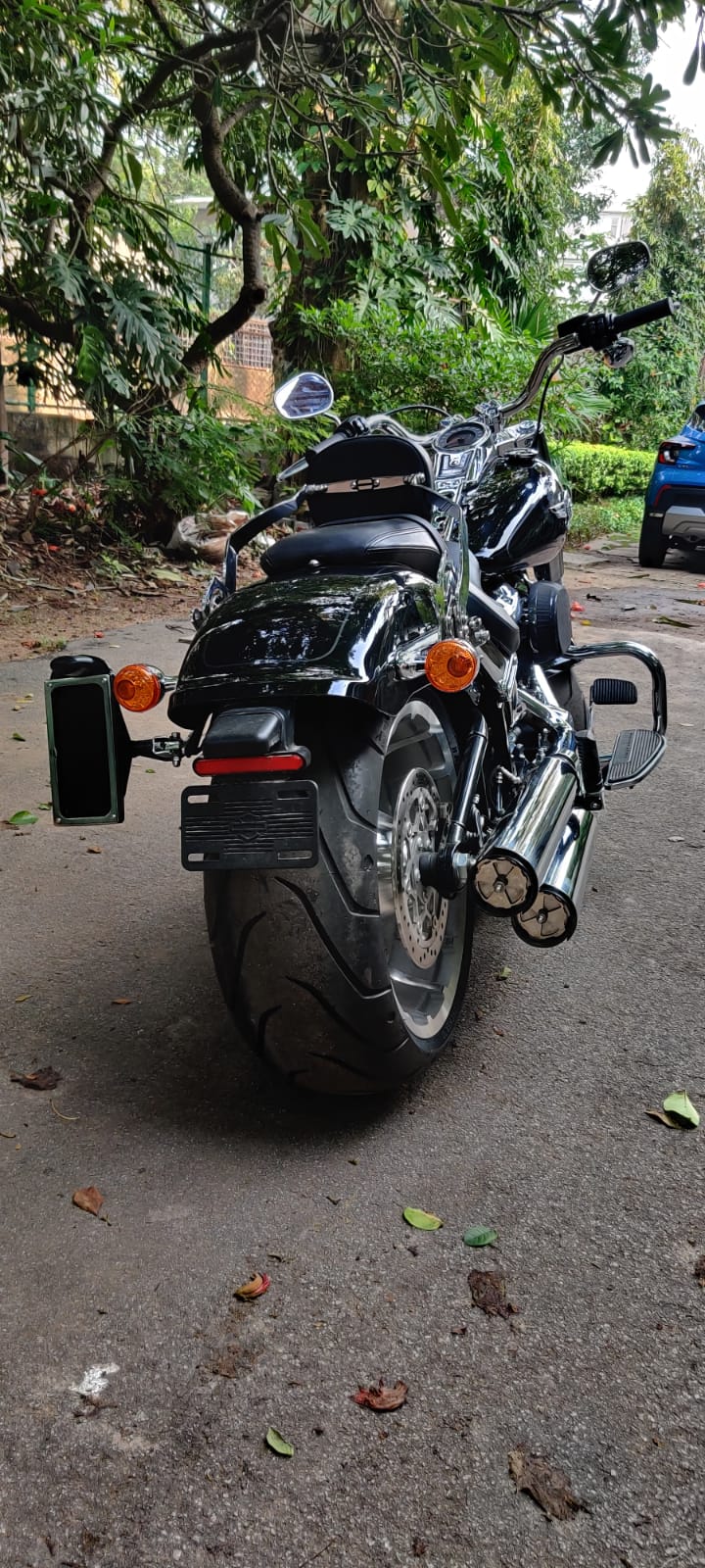 Rear view of a motorcycle with a side-mounted number plate