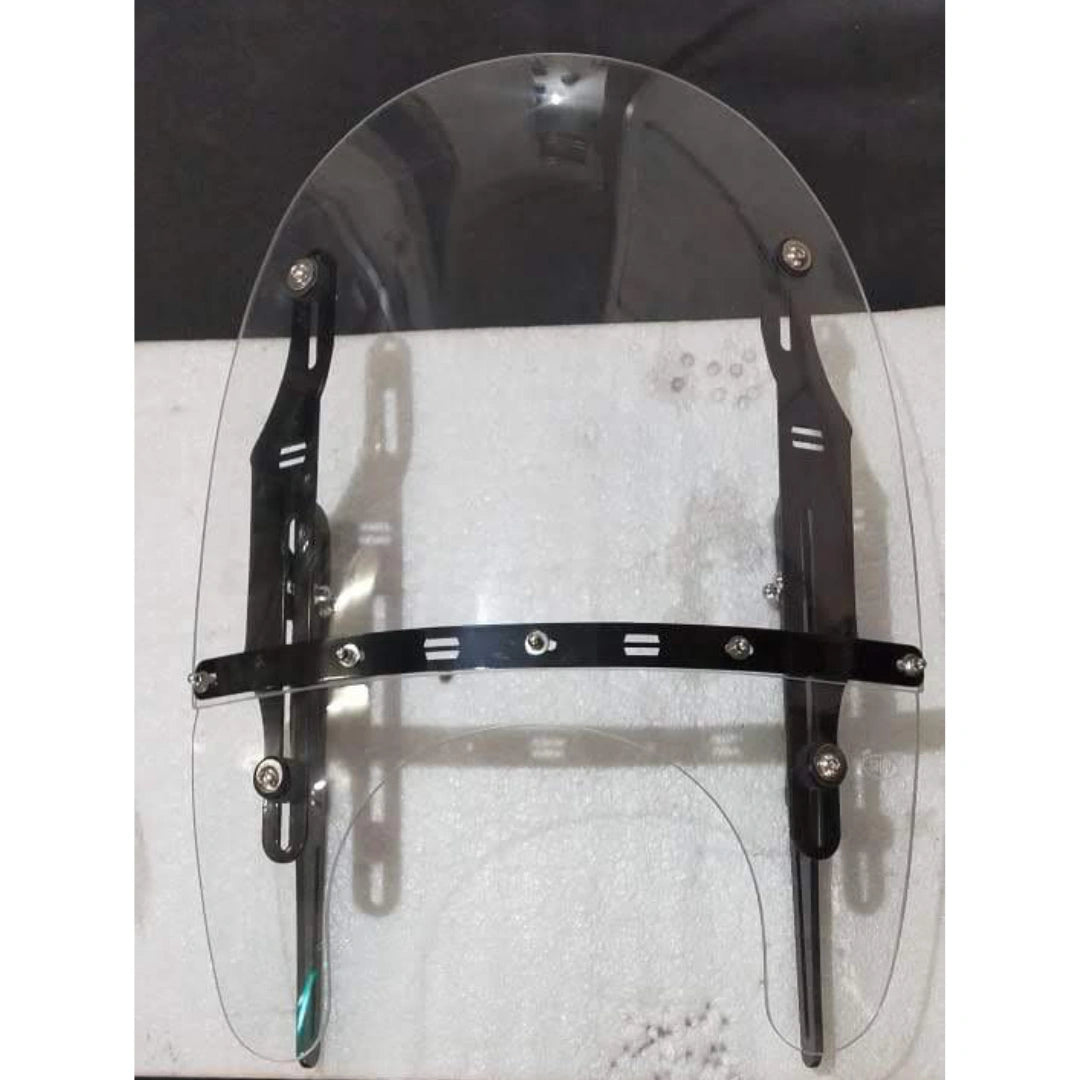 Clear motorcycle windshield showing the adjustable mounting arrangement