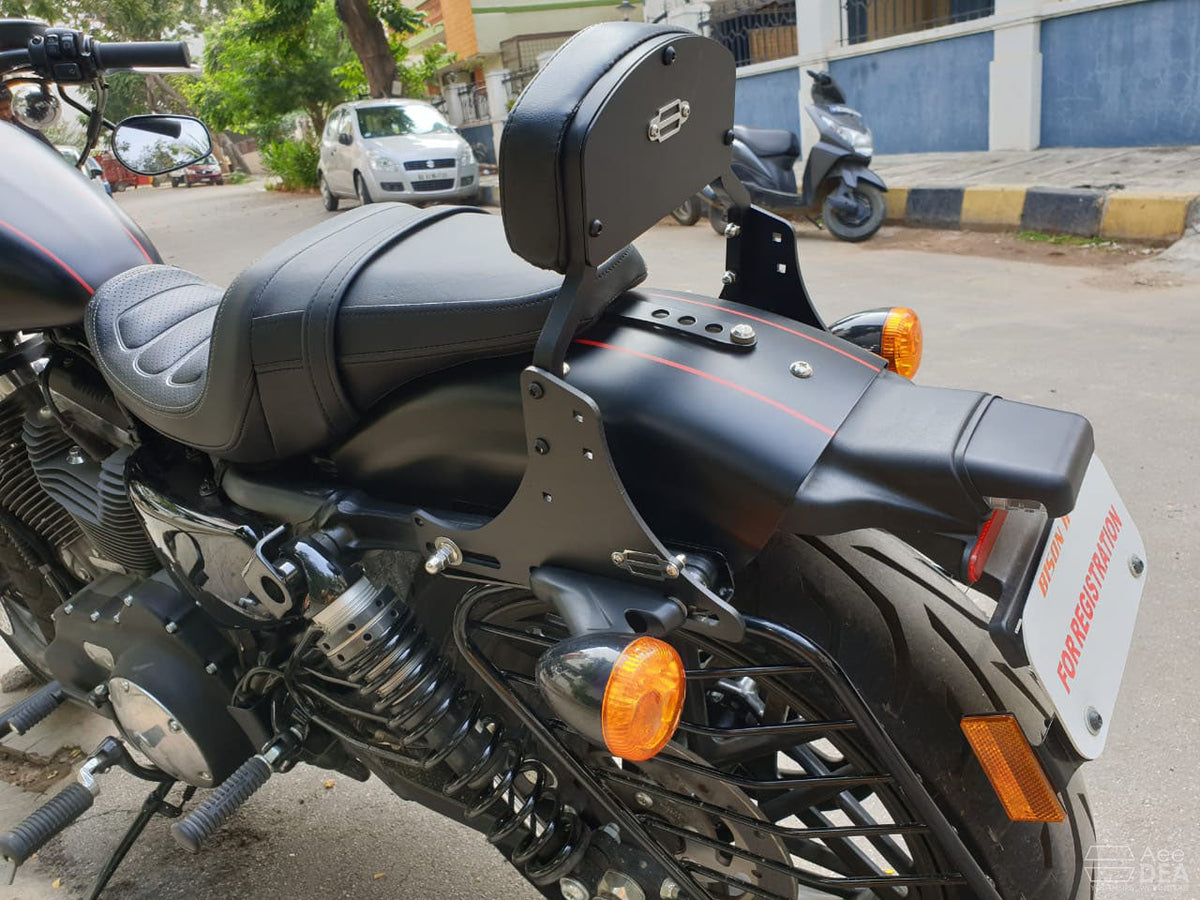 Rear three-quarter view of a motorcycle with a tall pillion backrest installed
