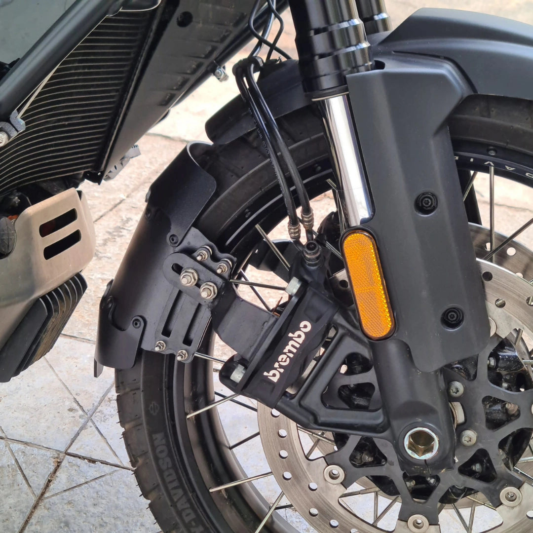 Close-up of AeeDEA front mudslinger installed near the left side of the Pan America front wheel
