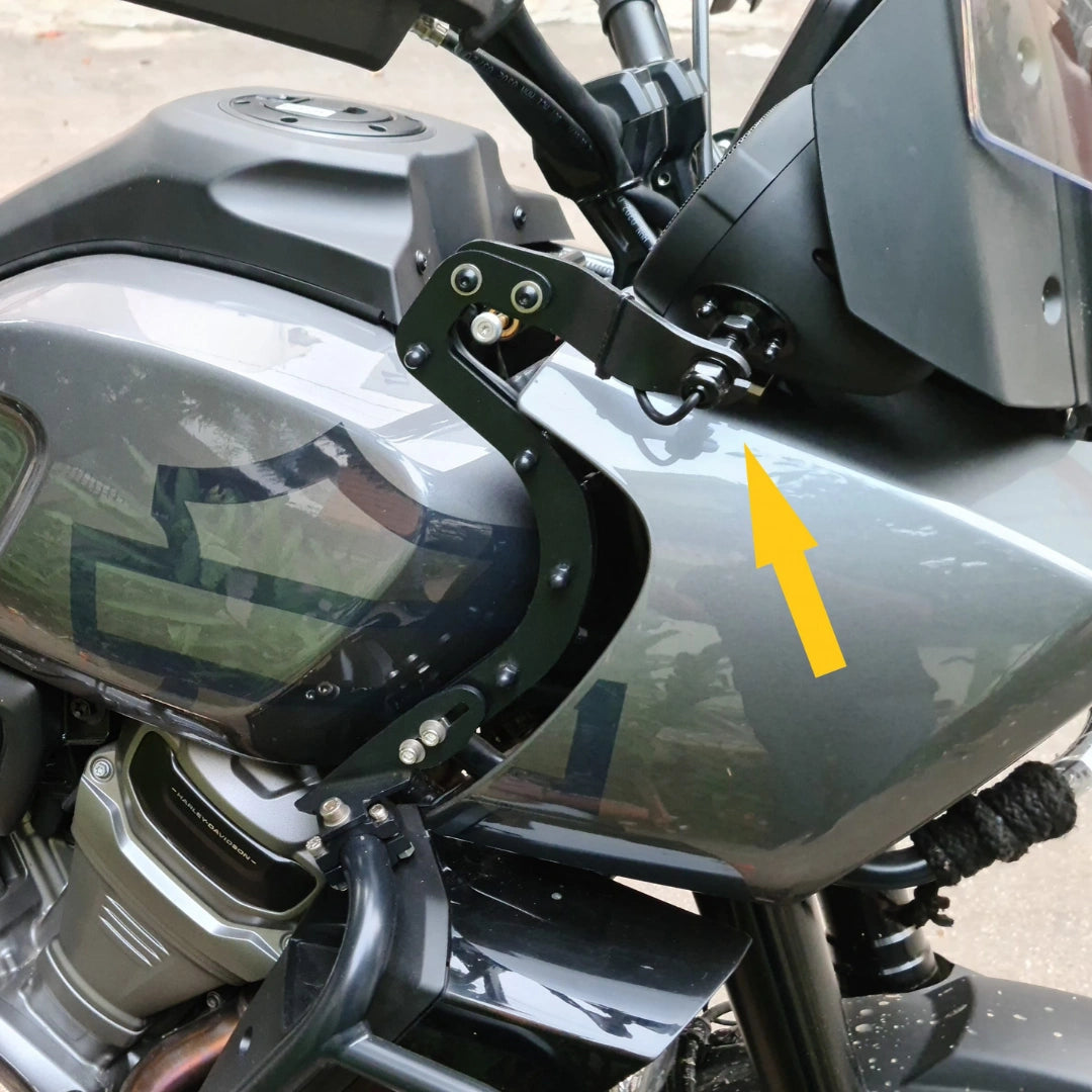 Close-up of AeeDEA speaker mount bracket installed beside the Pan America fuel tank