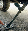 Close-up of AeeDEA Stand Boot mounted on the Harley-Davidson Pan America side stand