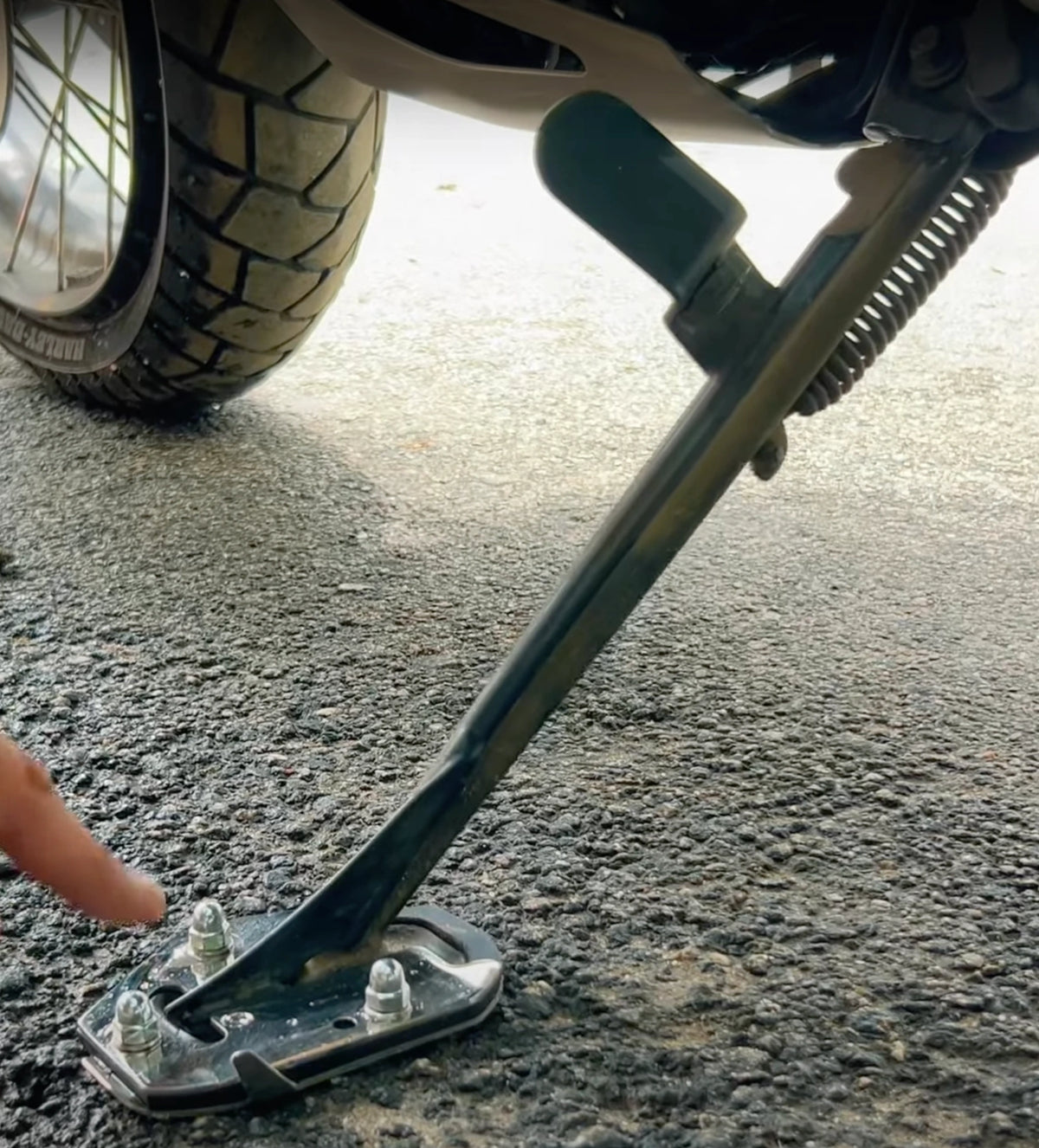 Close-up of AeeDEA Stand Boot mounted on the Harley-Davidson Pan America side stand
