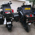 AeeDEA touring top box shown alongside other motorcycle luggage boxes for size comparison