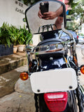Rear view of a motorcycle with a pillion backrest and chrome-finish luggage rack
