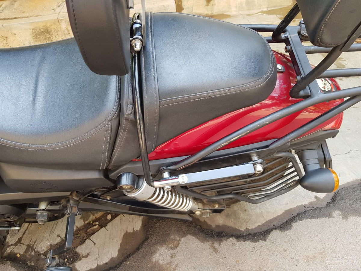 Close-up of the rider backrest mounting bracket installed beside the rear motorcycle seat