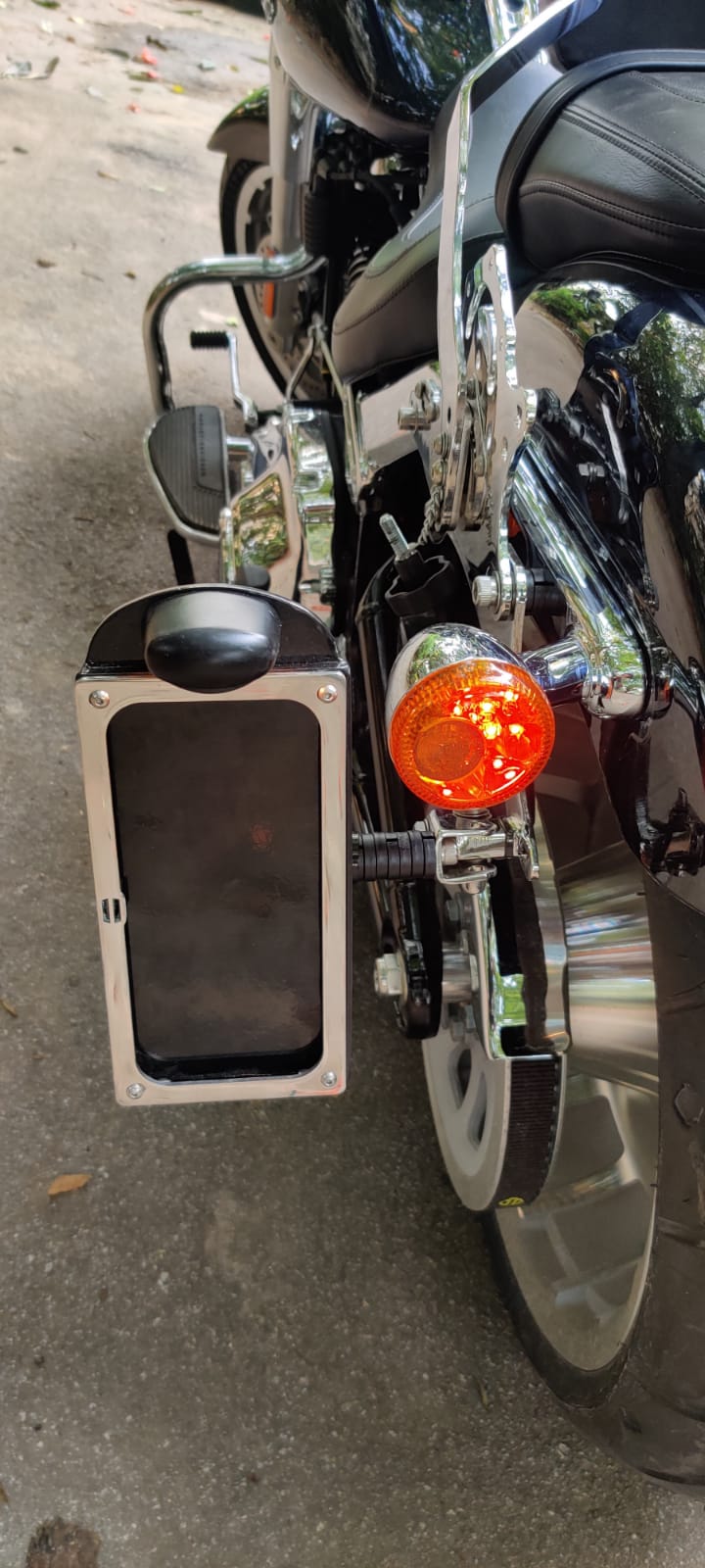 Close-up of the side-mounted number plate frame and its mounting bracket