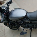 Close-up of a Sports-style footboard beside the motorcycle engine