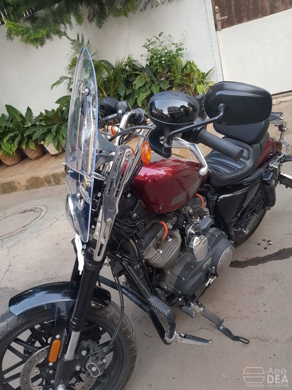 Three-quarter view of the AeeDEA adjustable windshield fitted to a Sportster 48