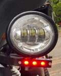 Close-up of integrated LED strip on AeeDEA auxiliary light mount beside the auxiliary light