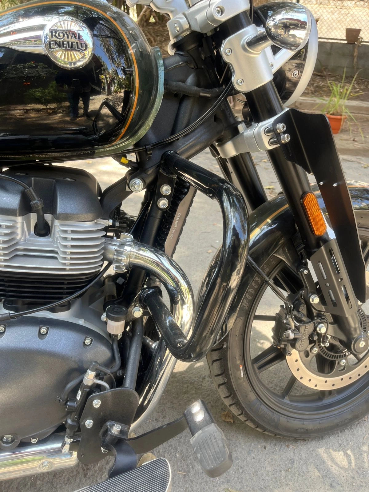 AeeDEA front crash guard installed beside the engine and front wheel of Super Meteor 650