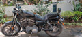 Cruiser motorcycle fitted with a tall pillion backrest behind the seat