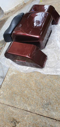 Glossy maroon touring pannier boxes and black backrest viewed from above