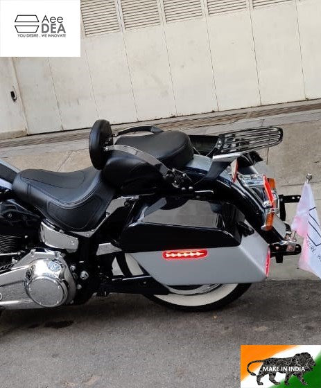 Cruiser motorcycle with a side pannier and integrated red LED light installed