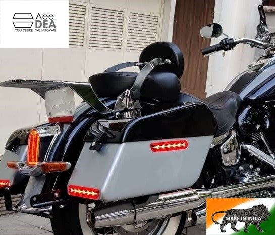 Close side view of touring motorcycle panniers with illuminated red LED strips