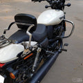 Side view of a white motorcycle showing the black crash guard beside the engine