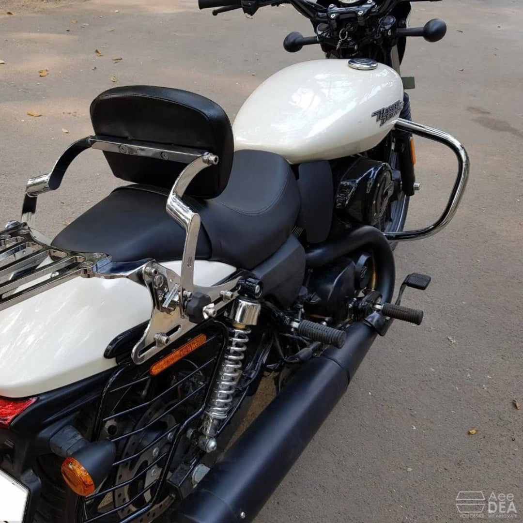 Side view of a white motorcycle showing the black crash guard beside the engine
